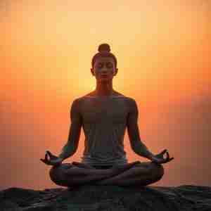 Silhouette of a in a person in a posture of meditation